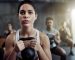 Shot of a fit young woman working out with a kettle bell at the gym